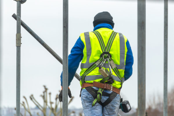 Professional Scaffolders erecting scaffolding on a building in the UK